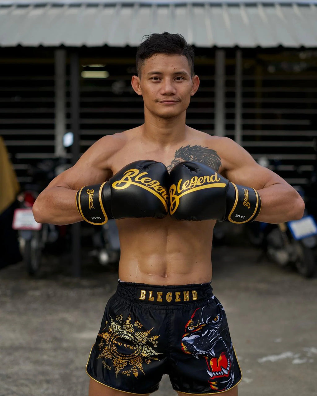 Blegend Black Tiger Muay Thai shorts in black and gold with dragon design