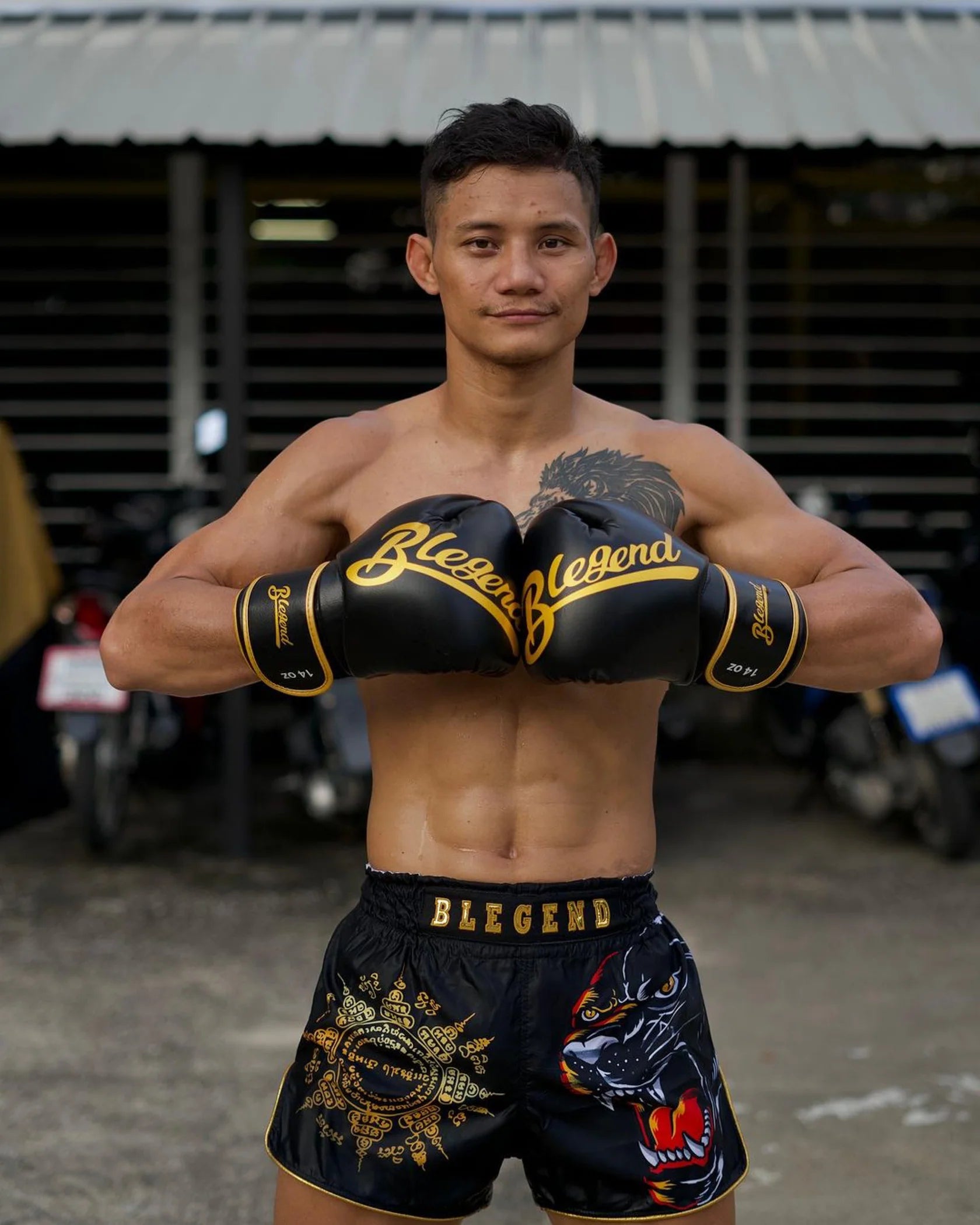Blegend Black Tiger Muay Thai shorts in black and gold with dragon design