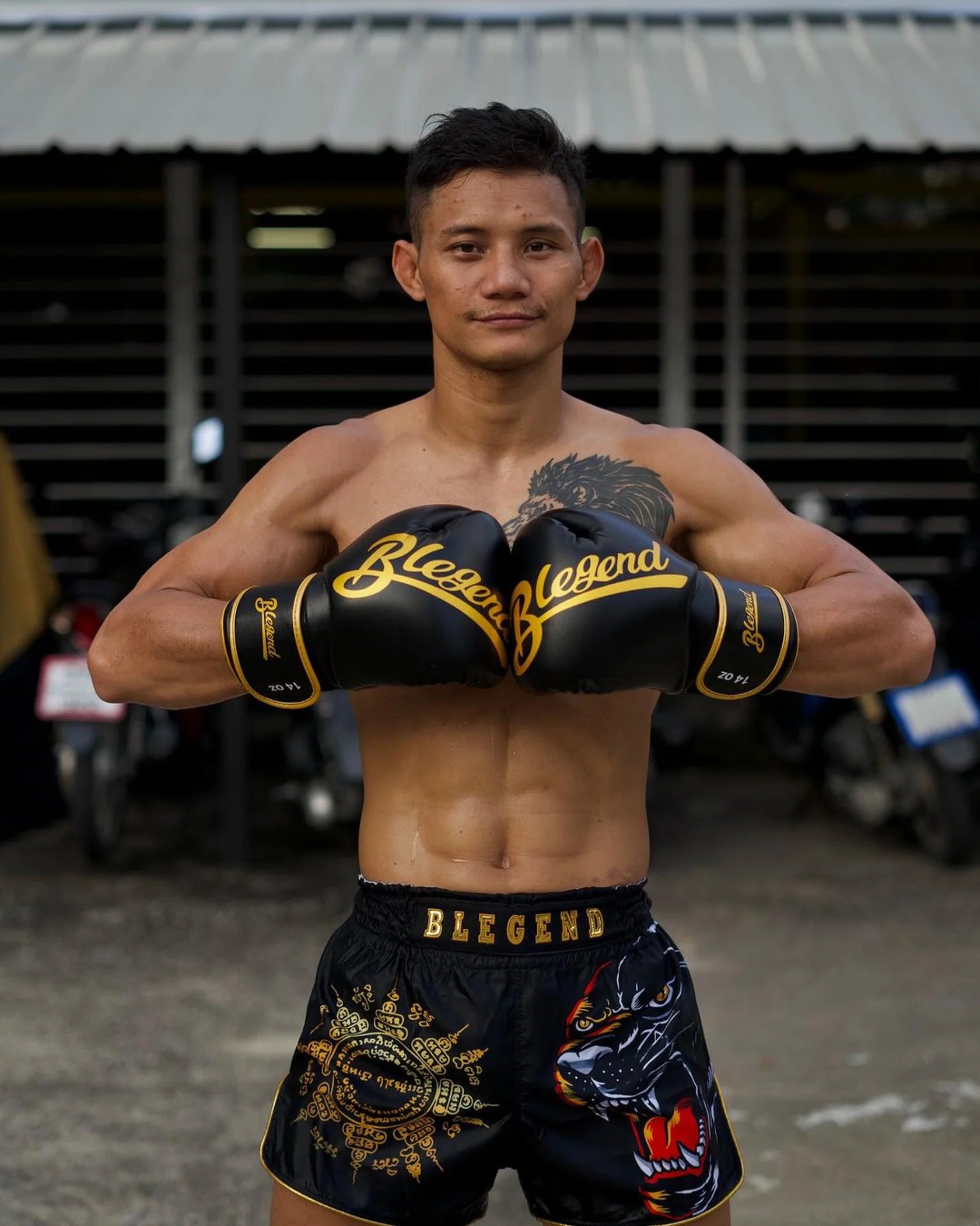 Blegend Black Tiger Muay Thai shorts in black and gold with dragon design