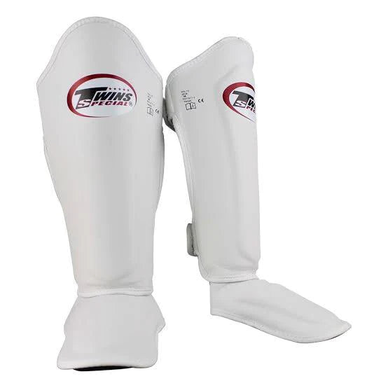 White Twins special shin guards with red and black accents