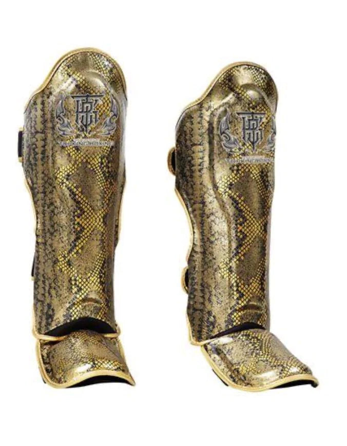 Top King Golden Shinguards in gold snake skin with black accents