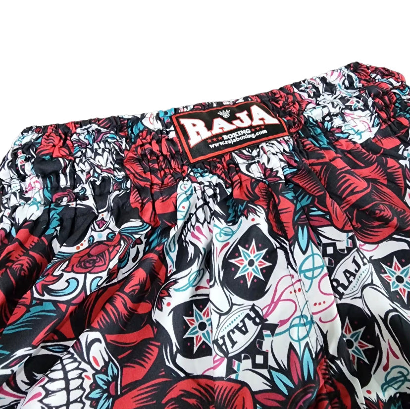 Raja Shorts Rose Skull swim trunks with red black skull accents